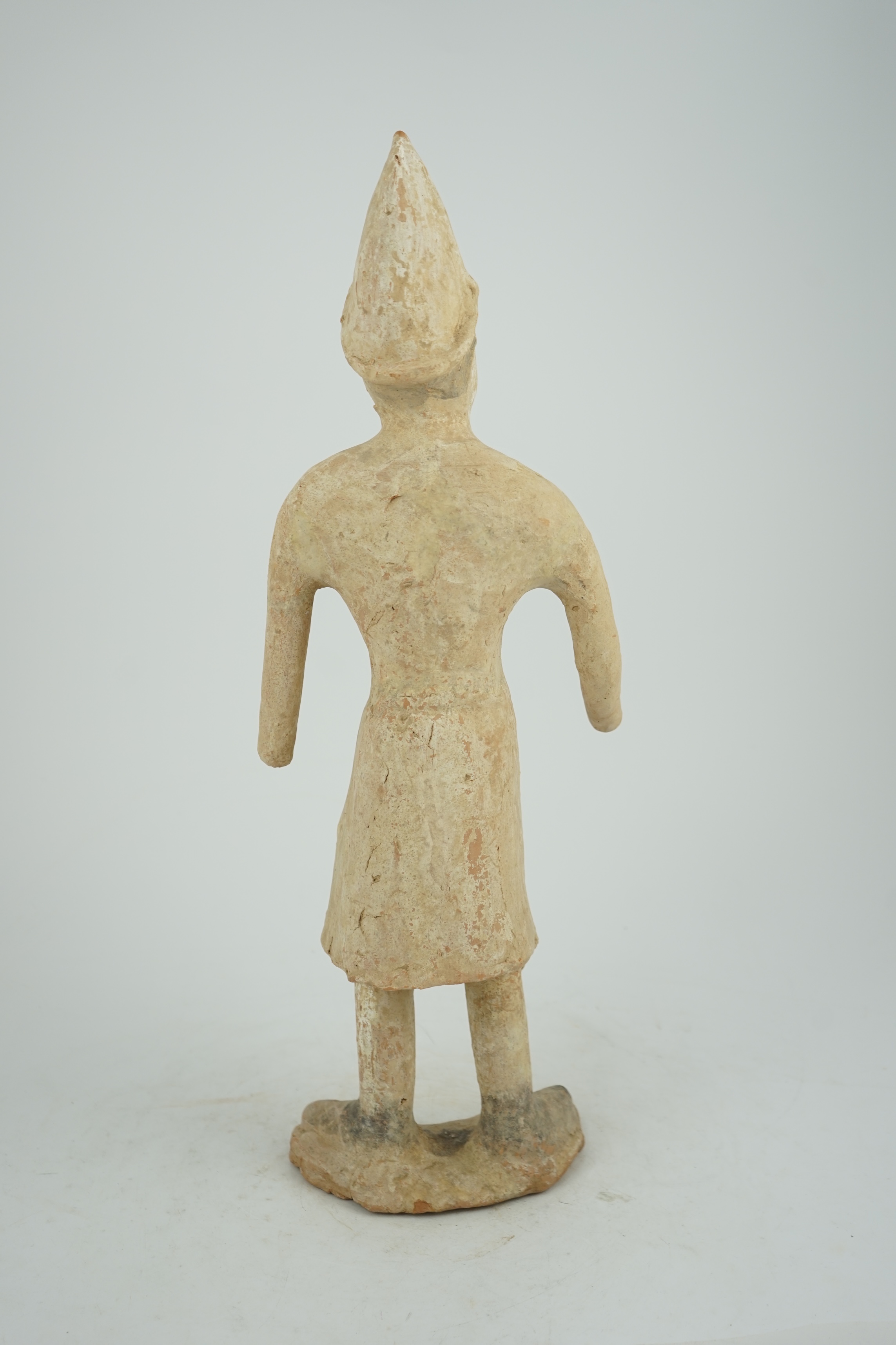 A tall Chinese painted pottery foreigner figure, Tang Dynasty (AD 618-906)